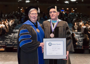 J.D. Mather, assistant professor of engineering design technology at Penn College, is presented with the Veronica M. Muzic Master Teacher Award (the highest honor bestowed upon faculty) by President Davie Jane Gilmour.