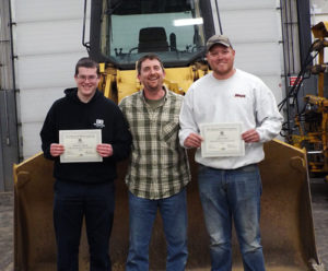 Penn College students Benjamin P. Coppola (left), of Danville, and Andrew M. Shane, of Boyertown, who have each been awarded $1,000 national tool scholarships, celebrate with diesel equipment technology instructor Chris S. Weaver (center).