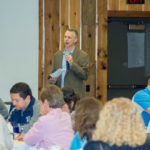 Reed helps to lead a group discussion.