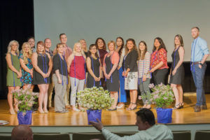 Some of the first inductees into the Pennsylvania College of Technology Bachelor of Science Nursing Honor Society gather on stage during a recent ceremony honoring their accomplishment.