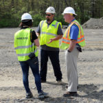 Peck (center) and Hoffman talk with Amy Crouse, Volvo Construction Equipment's product marketing and communication specialist.