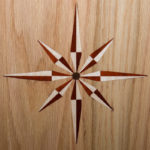 ... as do this compass rose, of bloodwood and hard maple ...