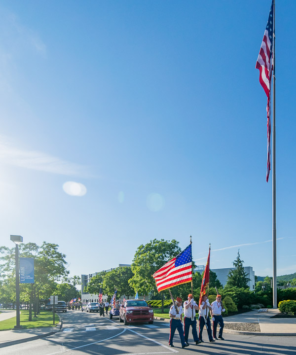 The Flags Across America March travels east on Hagan Way, nearing its destination outside the Student & Administrative Services Center.