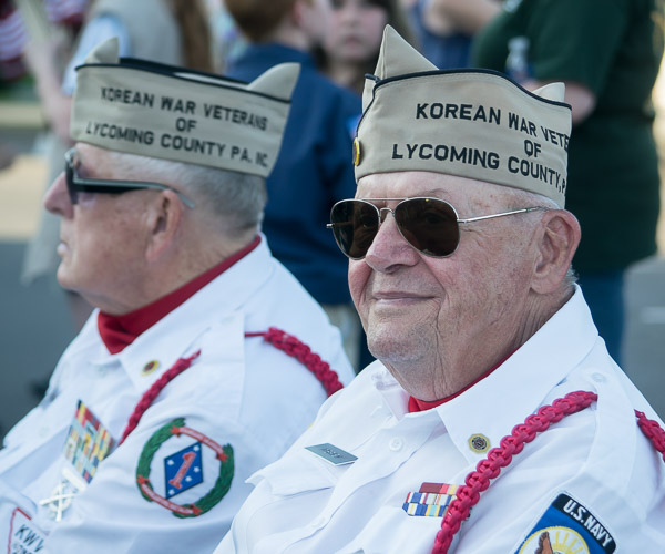 Rodney O. Brien, a member of the Korean War Veterans Honor Guard, joins colleagues in tribute.