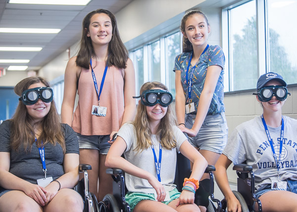 Campers visit the occupational therapy assistant lab, gaining appreciation for others' challenges.