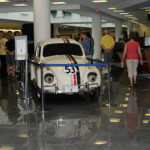 Part of the group venture to the library, where a pair of museum pieces – "Herbie," the Disney icon, and an 1899 Winton Phaeton – catch their collective eye.