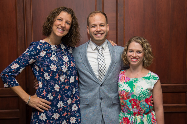 Alumni honoree Hickman celebrates with his wife, Leah (at right), and Kimberly R. Cassel, director of alumni relations. 
