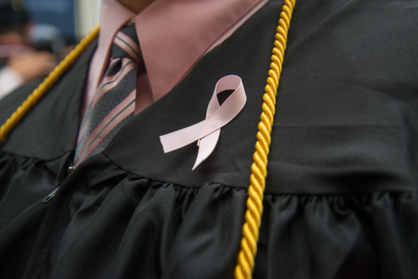 Physician assistant grads wore pink ribbons to support Megan E. West, a classmate who was diagnosed with breast cancer earlier in the week.