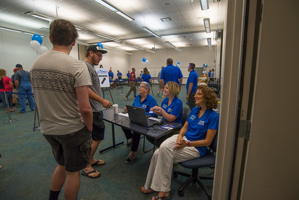 A trio of friendly faces – (from left) President Davie Jane Gilmour; Carolyn R. Strickland, vice president for enrollment management/associate provost; and Kimberly R. Cassel, director of alumni relations – greets students during check-in at College Avenue Labs.