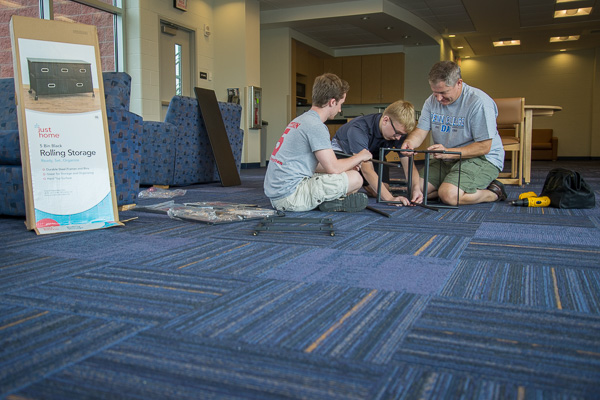 Appropriately attired in a “Penn College Dad” T-shirt, the father of Morgan R. Bloom uses a Dauphin Hall lounge for some last-minute 