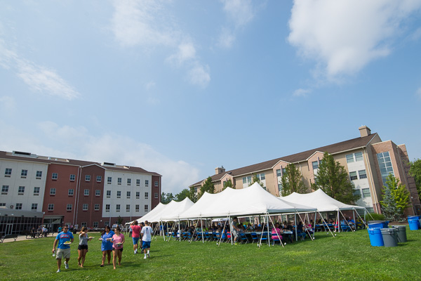 Blue skies and white tents greet guests at Rose Street Commons. 