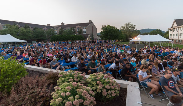 In a comfortable outdoor venue that was pelted hours earlier by a midsummer thunderstorm, students are given commemorative pins and introduced to the Penn College Alma Mater.