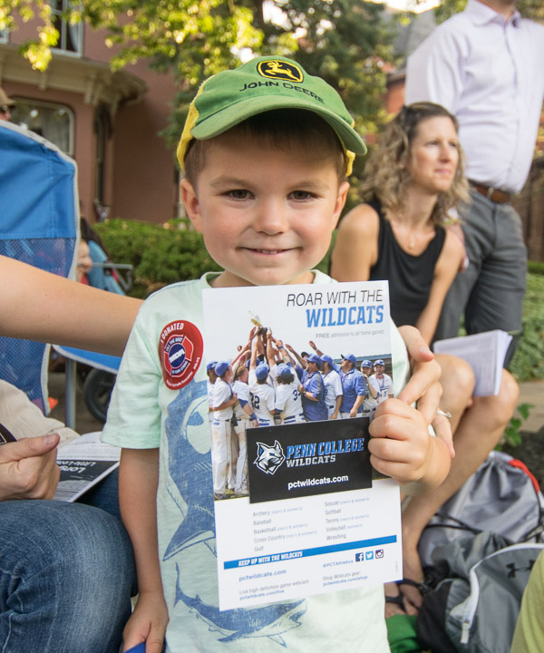 Sporting a hat worthy of several Penn College majors, a boy shows off his Wildcat magnet.