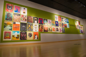 Posters line a wall in The Gallery at Penn College for the National Poster Retrospecticus, on display through Oct. 11.