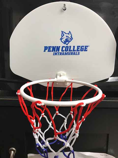 The college's new Wildcat logo adorns an intramural mini-hoop.