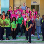 On the steps of a school in Las Terrenas, Santo Domingo, Penn College students join a group of teachers and administrators. The students conducted clinics in four schools in four days at Las Terrenes.