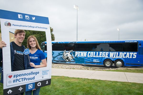 Everett B. Appleby and Erin N. Shaffer share the limelight with the college's new traveling spokesmodel.