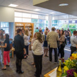 The lobby of the Center for Business & Workforce Development bustles with business banter. 
