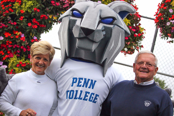 Linda and Ed Alberts, scholarship donors and longtime friends of the college, cozy up to the 'cat. Linda, a member of the Penn College Foundation Board of Directors, joined the Wildcat Club at the Varsity Level.