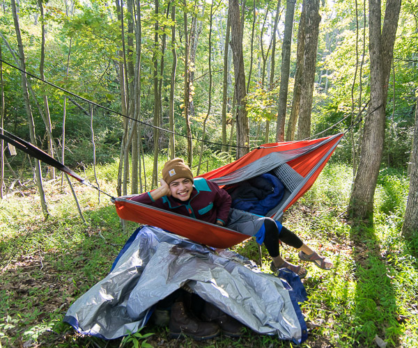 Samuel J. Pham lounges in his above-ground accommodations under a leafy canopy at the ESC. An aviation maintenance technology major from Camp Hill, he also led a Friday night hike on the woodland campus's nature trails.