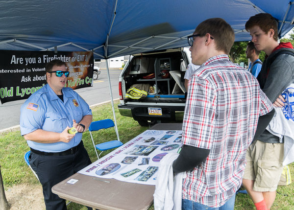 A member of the Old Lycoming Volunteer Fire Co. talks with prospective recruits about a vital community service.