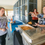 Cheryl Y. Hammond, Dining Services' special events manager, serves Community Peer Educator Tasia A. Werkmeister ...