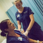 Kaitlyn L. Andersen, of Mastic, N.Y., enrolled in the Fundamentals of Nursing course, swabs the arm of classmate Emily L. Tashner-Thompson, of Muncy.