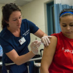 Jessica M. Dreese, a student in Adult Health Nursing I, immunizes nursing student Ciara N. Bond.
