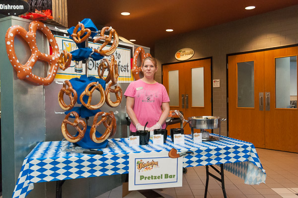 A jumbo soft-pretzel bar is in the capable hands of Crystal E. Way, a campus catering assistant.