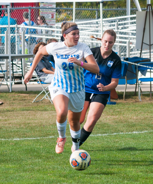 Midfielder Jane Herman sets the pace, shadowed closely by Ashlee Bourquin of the Wilson College Phoenix.