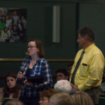 Web and interactive alumna Lana A. Kephart poses a question to the presenters (alongside Penn College Police Chief Chris E. Miller, who helps facilitate Q&A for the Colloquia Series).
