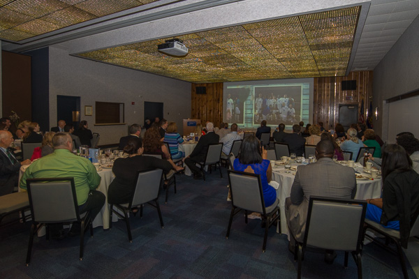 Guests at the Hall of Fame Banquet, held in the Thompson Professional Development Center, enjoy images from inductees’ Wildcat days. 