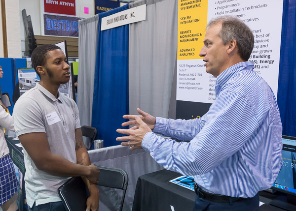 Philadelphian Frank M. Lee-Claxton, majoring in the building automation technology: renewable energy technologies concentration, has a one-on-one audience with HVAC Concepts' Bryant Butler.