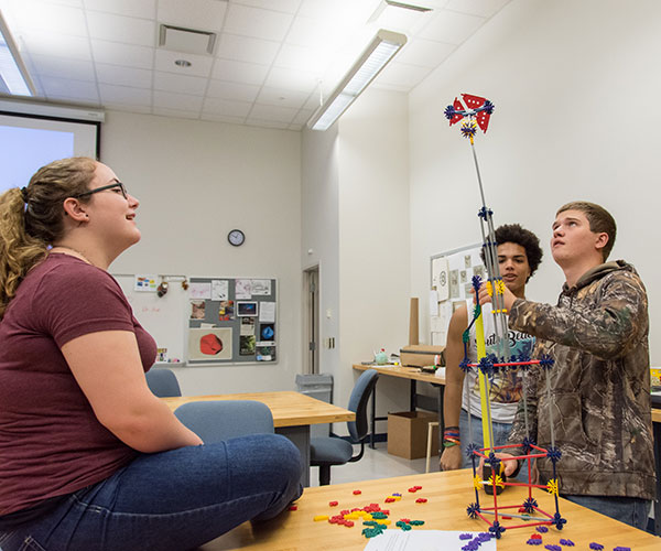Students from Central Columbia High School test how tall they can build a K’nex structure as part of a morninglong session that introduces the field of industrial design. They reached 44 inches.