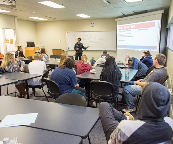 Lisa M. Andrus, special assistant to the dean of business and hospitality, guides students through the many considerations of planning an event as she introduces them to the business administration: sport and event management concentration.