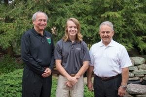 Gary Kincel (left), Coventry Foundation president, and Gary Hagopian, a member of the foundation’s board of directors, join Penn College student Luke C. Miller, of Grasonville, Md., the first recipient of the organization’s automotive restoration technology scholarship.