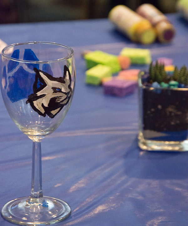 Guided by The Glaze to Be, a local business that helps people of all skill levels to find their inner artist, attendees fashion commemorative wine glasses.