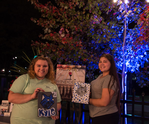 Andrea L. Solenberger (right), an applied management student from Harrisburg, brought along a friend to personalize their Wildcat portraits.
