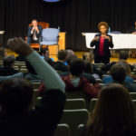 An actor engages the audience ...