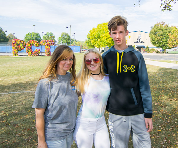 Information assurance and cyber security major Brandon A. Bauman, of Hellertown, soaks up some Saturday sunshine with mother Francesca and sister Madison.