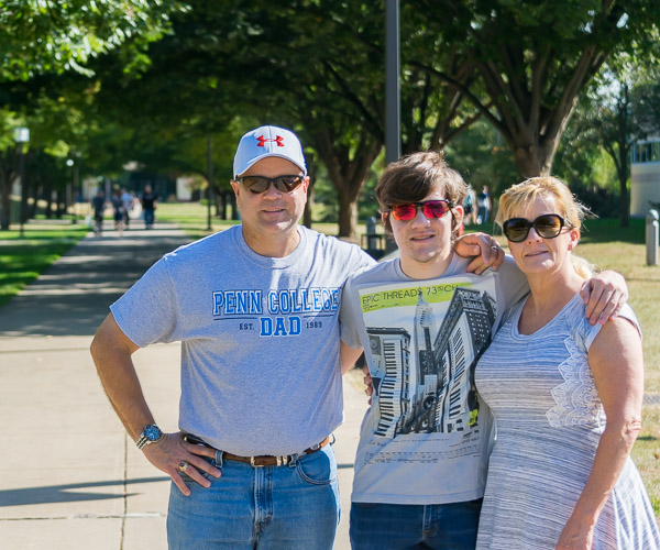Thomas M. Czaus II, of Morgantown, enrolled in information technology sciences-gaming and simulation, reunites with parents Thomas and Rosemary.