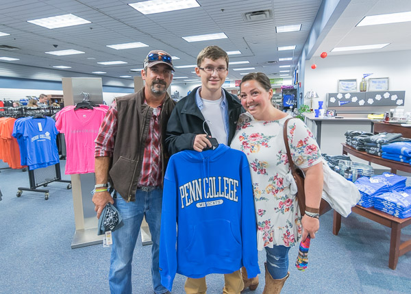 David Galemore, of McSherrystown, with parents Tom and Rachel, picks out a souvenir in The College Store.