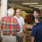 Donald J. McTarnaghan (left) talks with Harry W. Hintz Jr., instructor of construction technology; and students Aaron F. White and Patrick J. Kelly, members of the Penn College Construction Association.