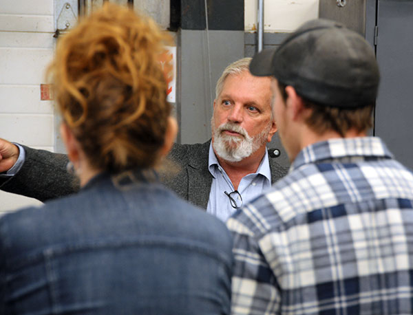 Bill P. Kilcoyne Jr., a diesel equipment technology instructor, leads a tour of ESC labs.