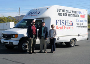 Brent M. Fish (center), president of Fish Real Estate, delivers a box truck to Don J. Luke, director of facilities operations at Penn College, and Loni N. Kline, vice president for institutional advancement.
