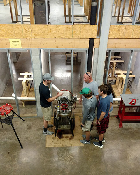 In an overhead shot that showcases the double-decker layout of the heating, ventilation and air conditioning lab, HVAC technology major Jared J. Mooney. of Palmerton, talks shop.