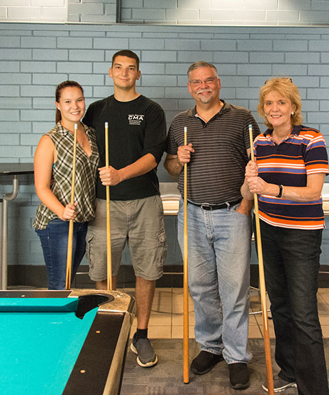 The parents and girlfriend of construction management student Peter B. Hopke made the trip from Metuchen, in central New Jersey, to spend quality time, including a Friday round of pool in CC Commons.