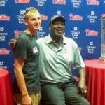 Penn College sport and event management student Devon M. Sanders, of Bloomsburg, networks – and has his photo taken – with 1983 NLCS MVP and former Phillies broadcaster Gary “Sarge” Matthews. 