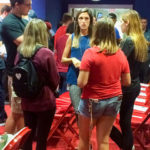 Students gather around a Phillies front-office staffer during a networking hour. 