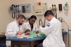 Penn College physician assistant students practice their suturing skills. During National Physician Assistant Week, the Penn College physician assistant program is celebrating the announcement of its continued accreditation through the Accreditation Review Commission on Education for the Physician Assistant.